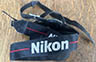Nikon Black / red strip 10.00